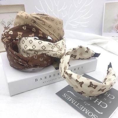 China Fashion New Style Headbands Hair Accessories Twist Knot Designer Cross Headbands For Women for sale