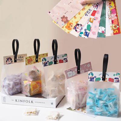 China High Quality Clear Candy Paper Card Snack Bag Flat Bottom Handle Barrier Gift Packaging Plastic Bag for sale