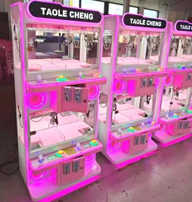 China SDK Wholesale Mini Coin Operated Electronic Claw Machine Toy Vending Catch The Doll Game Machine for sale