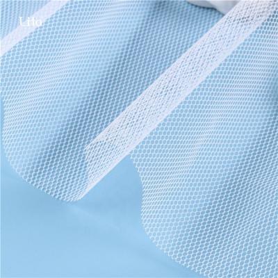 China 100% Polyester Anti-Static Classic Stiff Mesh Tulle Fabric For Dress Petticoats Rolls Edge Tulle Fabric Decoration for sale