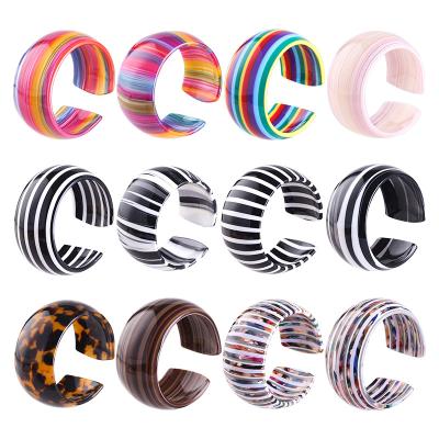 China Environmental friendly logo engraving bracelets hug cuff bracelets high quality custom plastic resin bracelets empty colorful handmade bracelets for sale