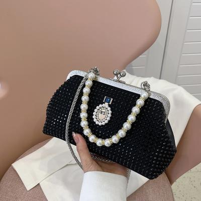 China Water Resistant 2022 Fashionable Women Ladies Shoulder Wrist Chain Bag Cross - Body Purse Fashion Wrist Bag With Diamond Pearls for sale