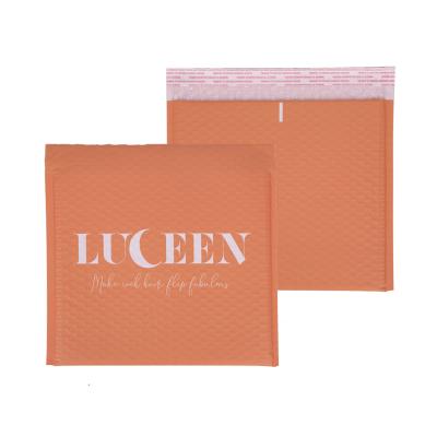 China Strong Adhesive/Shock-resistance/Waterproof/Nice Printing Designer Boutique Custom Poly Bubble Mailers Self Seal Orange Padded Envelopes Shipping Bag For Jewelry And Cosmetics for sale