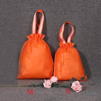 China Waterproof Non Woven Cheap Bag Logo Shopping Slogan Custom Christmas Drawstring Luxury Bags Christmas Gift for sale