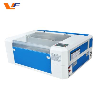 Κίνα 4060 mini laser universal engraving and cutting machine glass laser carving machine 40w 60w small cnc laser cutter προς πώληση