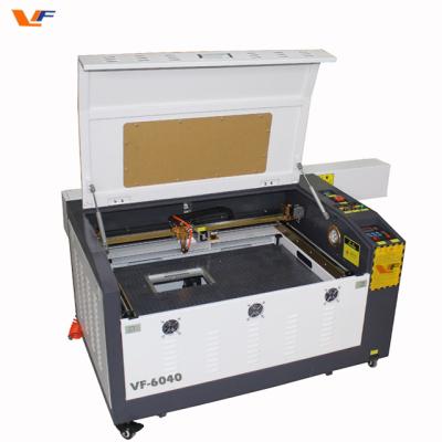 China Laser cut desktop machine CNC machine 50w 60w co2 lazer co2 laser cutting machine small laser cutters for sale