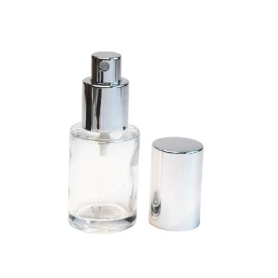 China Cosmetic 30ml 50ml 100ml Clear Glass Round Empty Perfume Bottles With Aluminum Pump Sprayer for sale