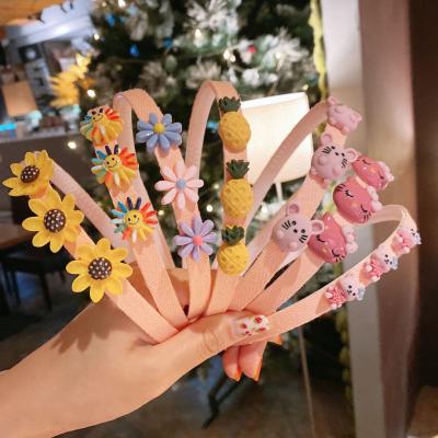 China Environmental Friendly Multiple Kawaii Kids Anti-slip Headband Cute Daisy Flower Head Band For Kids Wholesale for sale