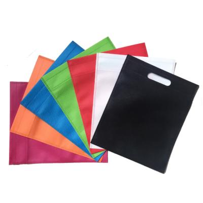 China Handled Tender Hot Cheap Price Portable T-shirt Packaging Custom Eco-Friendly Products Non Woven Shopping Cut Out Bags for sale