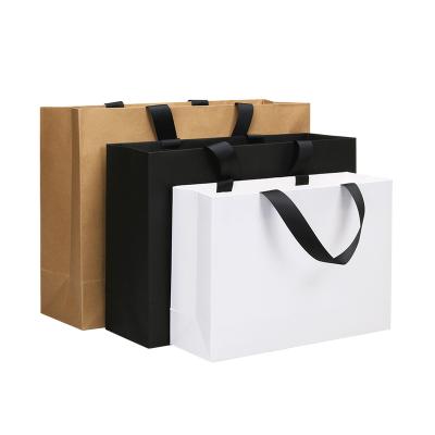 China Wholesale Biodegradable Luxury Black Shoes Clothes Kraft Paper Bags Printed Logo Custom Packaging Paper Bag Clothing Shopping Gift Jewelry for sale