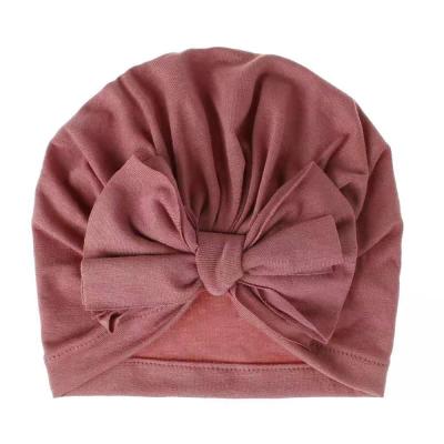 China Fashion Hair Accessories Solid Color Girls Friendly Material Donuts Cover Headbands Tied Turban For Babies for sale