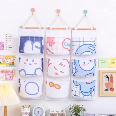 China Canvas Cartoon Organizer Bag 3 Pockkets Hanging Wall Organizer Storage Products Viable for sale