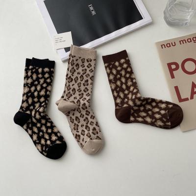 China Edge buckle bangs sell high quality leopard print embellished double road cotton girls fashion socks for sale