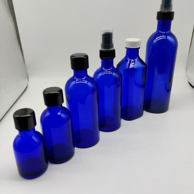 China Personal Care Cobalt Blue Essential Oil Glass Bottle Craem Glass Jar for sale