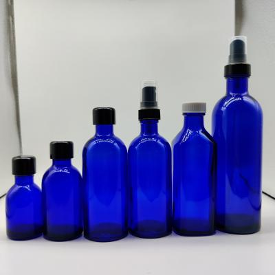 China Long Neck 200ml Screw Cap Glass Cosmetic Blue Bottle Rose Hydrochloric Water Bottle for sale