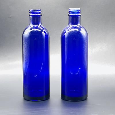 China 200ml Long Cosmetic Bottle Neck Lotion Glass Bottle Essential Oil Glass Bottle Blue Water Bottle for sale