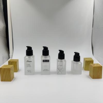 China High Quality Personal Care Packaging 15ml20ml30ml40ml Square Glass Cosmetic Bottle For Essential Oil With Pump And Cap for sale