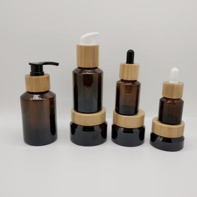 China Cosmetic Cosmetic Packaging Glass Bottle And Jar Set Shoulder Amber Slant Bottle And Jar With Bamboo Lid/Dropper/Pump for sale