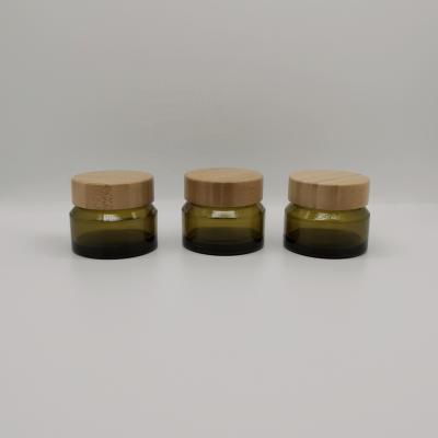 China 50g Series Cosmetic Glass Cream Olive Oblique Shoulder Jar Packaging Glass Jar With Bamboo Lid for sale