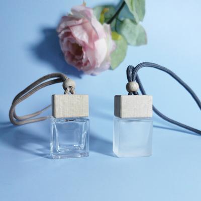 China 10ml Air Freshener Cosmetic Wholesale Diffuser Empty Frosted Car Hanging Perfume Bottle With Wooden Cap for sale