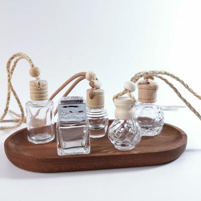 China Car Cosmetic Empty Wooden Glass Air Freshener Cap Perfume Bottle Hanging Perfume Bottle Diffuser for sale