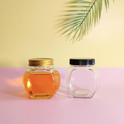 China Wholesale Food Hexagon Glass Container Storage Bottle With Metal Lid Honey Jar Food Storage Bottle Glass for sale