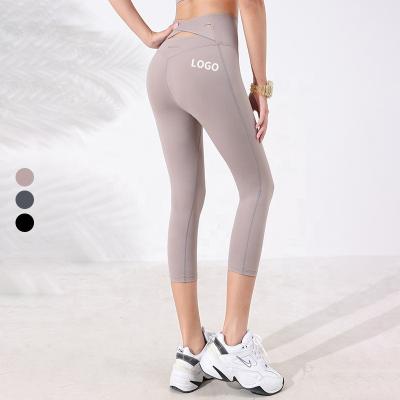 China Breathable High Waist Anti Cellulite 3/4 Length Crossed Workout Gym Women Yoga Leggings Capris Back Sports Pants for sale