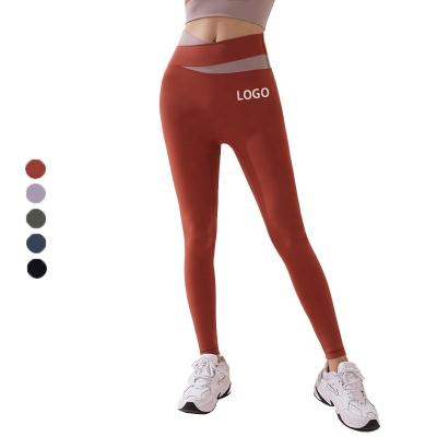 China Seamless Breathable Fitness Yoga Pants Women's High Waist Tight Elastic Nudity Legging Color V-Shaped Gaiters for sale