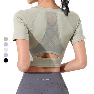 China Breathable Women's Slim Fit Workout Tops Mesh Back OEM Shorts Sleeve Gym Fitness Sporty Shirt Yoga Crop Tops for sale