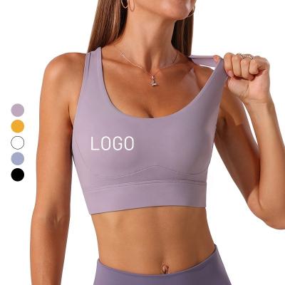 China Antibacterial Wholesale Women Yoga Bra Adjustable Sexy Cross Back Bra Sports Running Workout Gym Top for sale