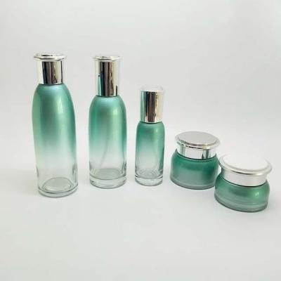 China Green glass cosmetic bottle and jar of the largest personal care factory empty gradient for sale