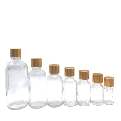 China Wholesale High Quality Personal Care 10ml 20ml 30ml 50ml Clear Perfume Essential Oil Glass Bottle With Gold Screw Top for sale