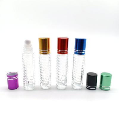 China Shandong Factory New Design 8ml Cosmetic Clear Blister Brand Round Roll On Glass Perfume Bottle With Plastic Cap for sale