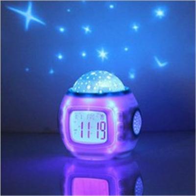 China Multifunctional Bedroom Alarm Clock Sleep Music Calendar Week Display Projector Night Light Moon and Star Projector Lamps for sale