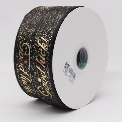 China Bright Color Stability Polyester Printed Ribbon Merry Christmas Foil Gift Box Wrapping Ribbon 6-40mm Wide Christmas Tree Decoration Strap for sale