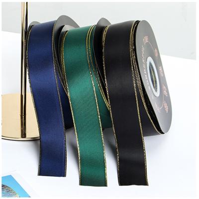 China Polyester Sustainable Ribbon With Edge 25mm Gold Flower Double Sided Valentine's Day Gift Box Valentine's Day Wrapping Ribbon for sale