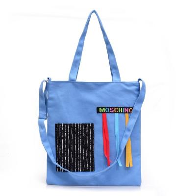 China Fashion Statistical Ins Style Large Capacity Shopping Bag Women's Personality Handbag Canvas Tote Bag With Colorful Ribbon Decorated for sale