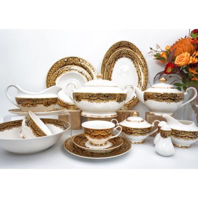 China RTS viable posuda 50pcs embossed gold dinner fancy new bone china ceramic tableware set for sale