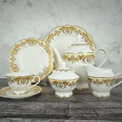 China New Viable Luxury Lotus Shape Ukraine Bone China 24pcs Embossed Gold Porcelain With Teapot Porcelain Tea Sets for sale