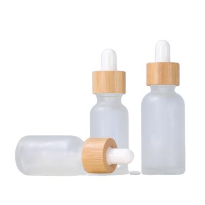 China Hot Sale 30ml 50ml Cosmetic Essential Oil Dropper Glass Bottle Frosted Bamboo Glass Dropper Bottle for sale