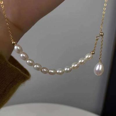 China Simple and light luxury style TRENDY adjustable length 14K gold filled freshwater chain high quality millet shaped pearl necklace for sale