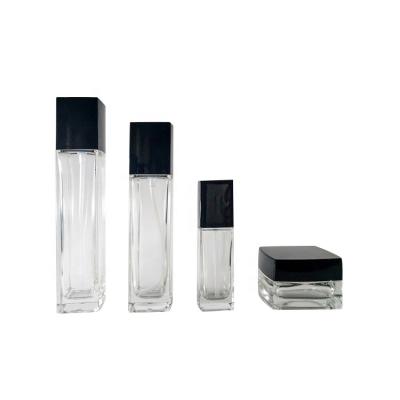 China Luxury Personal Care New Arrival Glass Bottle Cosmetic Packaging Jar Set With Plastic Lid for sale