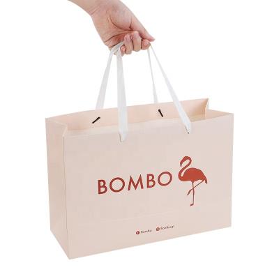 China Xiaoyin Recyclable Low Cost OEM Gift Retail Cheap Custom Printing Luxury Paper Bag With Your Own Logo Print for sale