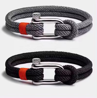 China CLASSIC Personalized Boys Stainless Steel Bow Buckle Bracelet Hand Woven Hand Rope Sports Bracelet Black Silver Blue Casual Sports for sale