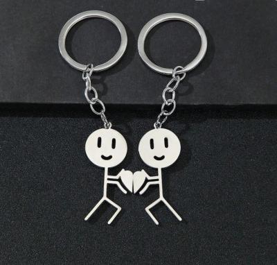 China Sports Stainless Steel Match Man Sports Play Basketball Pair Of Heart-Shaped Keychains Custom Simple Fun Valentine's Day Gift Keychains for sale