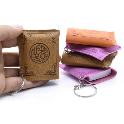 China Daily Life Multi Arabic Edition The Quran Wholesale Religious Book Morocco Paper Quran Book Key Chain PVC Key Chain for sale