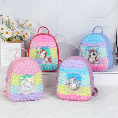 China Waterproof Children's Toy Bags Silicone Schoolbag Girl Boy Unicorn Pop Its Backpack Press Decompression Kids Rides Hot Gift for sale