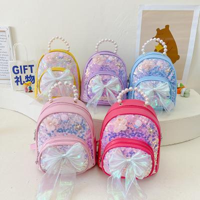 China Waterproof children's schoolbag fashion girl's bow shoulder backpack small kindergarten sequined cute baby bag for 2022 new fashion bag for sale