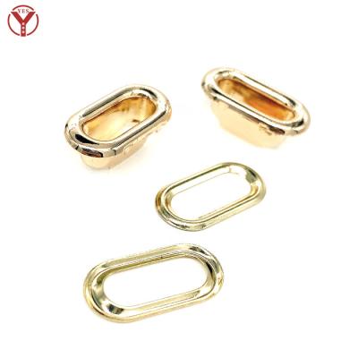 China Nickel Free Outer Size 17.5*9mm, 12*4mm Inner Oval Grommet in Hang Plating Light Gold Color for sale