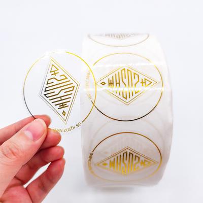 China Waterproof Self Adhesive Clear Manufacturer Custom Circle Logo Packaging Label Gold Foil Round Vinyl Sticker Label Roll for sale